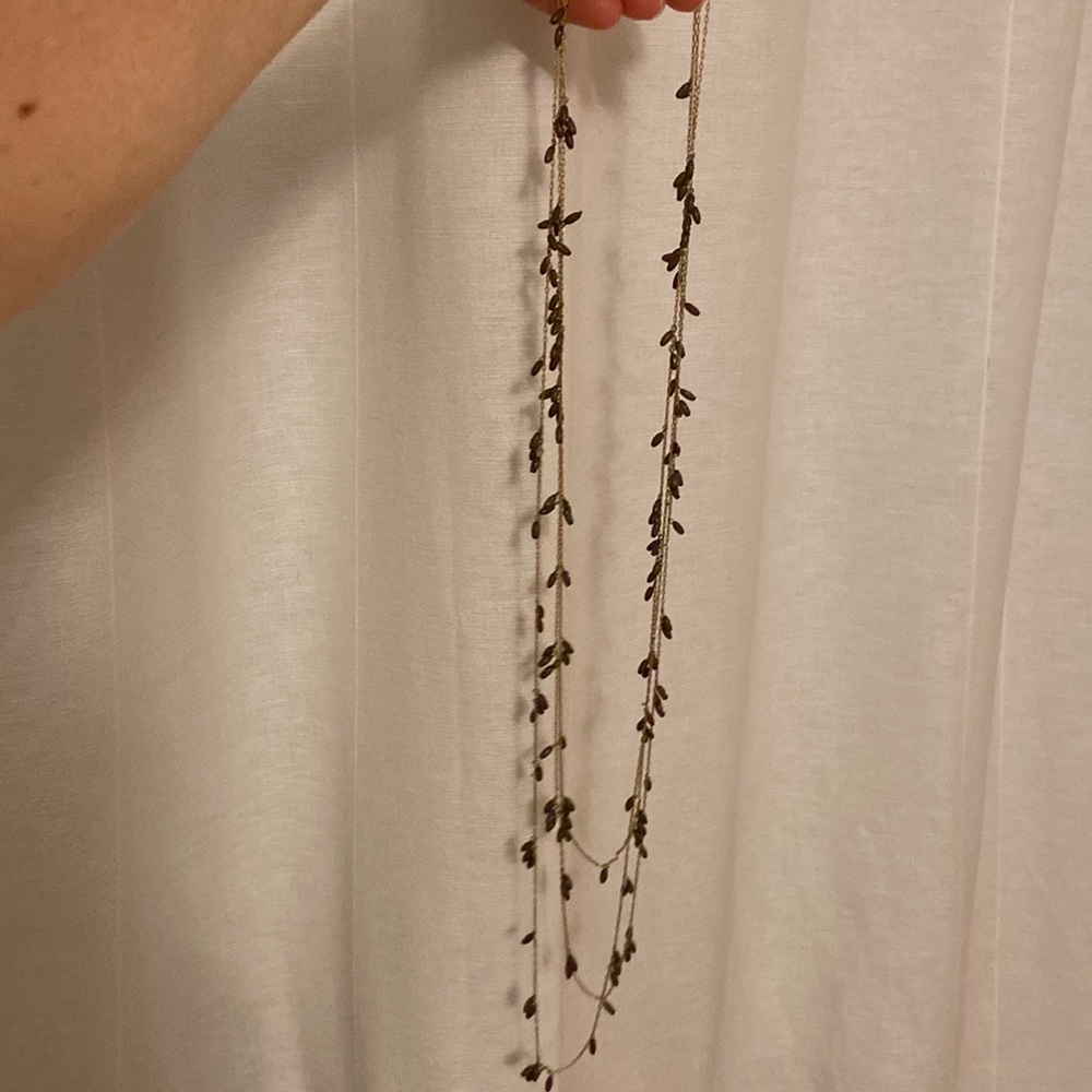 Delicate three tiered Banana Republic necklace with olive beads, gold plated.
